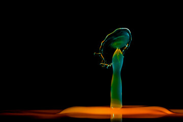 Color drops splash with umbrella or balls in fresh water