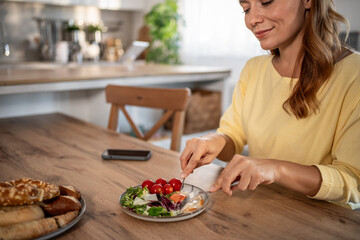 Woman eating healthy meal for diet and wellness