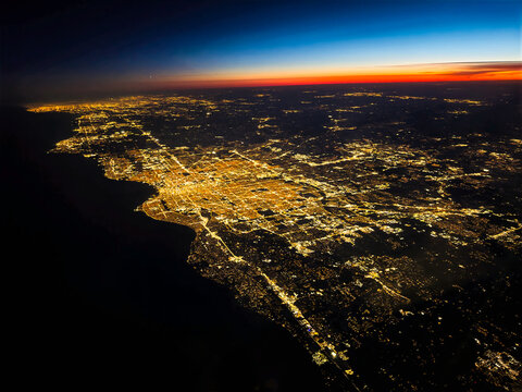 Nighttime sunset view of Milwaukee, Wisconsin viewed from the air with city lights