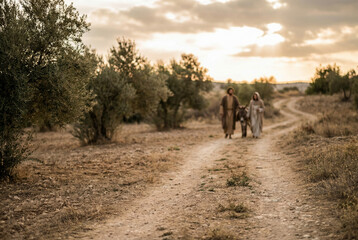 Joseph and Mary in the background. natural light and enviroment