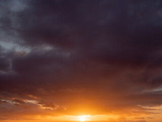 Obraz premium Dark dramatic sunset sky. Nature background for design. Strong colors.