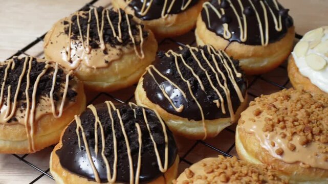 Chocolate and caramel donuts on the cooling rack