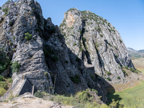 Rocky cliffs near the Presa de Montejaque with winding path in a natural landscape