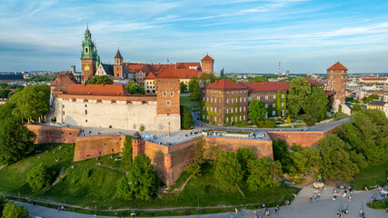 Aerial view of Wawel Castle in Krakow with historic fortifications, cathedral towers, royal courtyard and city skyline on a clear spring day in Poland © Vit Onopriienko