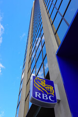 Fototapeta premium TORONTO - OCT 11: Sign of RBC (Royal Bank of Canada) at branch office in Toronto on Oct 11 2025. RBC is a Canadian multinational financial services company. 