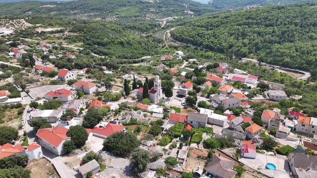 Drone footage showing the entire Novo Selo village surrounded by nature on Brac Island, Dalmatia, Croatia.