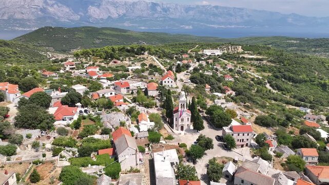 Aerial drone shot of Novo Selo village and surrounding fields on Brac Island, Dalmatia, Croatia.
