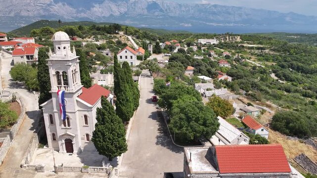 Drone footage showing the Church of the Annunciation in Novo Selo village, Brac Island, Dalmatia, Croatia.