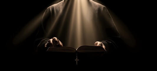 Monk Reading Holy Book with Rays of Light