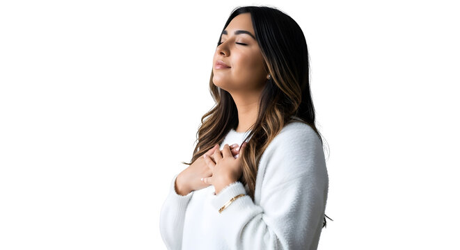 Beautiful young woman with long flowing brown hair wearing a cozy white sweater stands peacefully with eyes closed feeling gratitude on transparent background