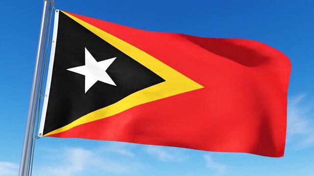 A red flag with a yellow triangle and white star against a blue sky