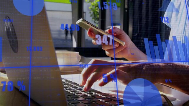 Woman tapping smartphone and typing laptop by window, reviewing finances while updating charts %