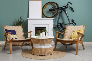 Naklejka premium Interior of living room with bicycle, fireplace and armchairs