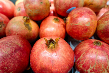 Pomegranates on the shelf in grocery store