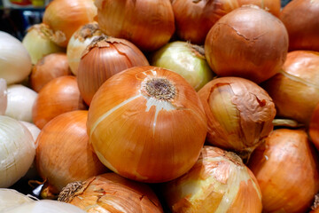 Onions on the shelf in grocery supermarket