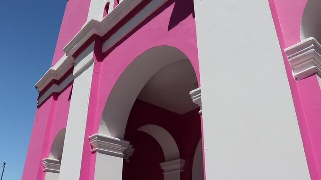 Tower of the Our Lady of Candelaria Church under the sun and blue sky in Copacabana Catamarca Argentina.