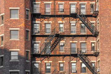 close up on old apartment building with emergency stairs