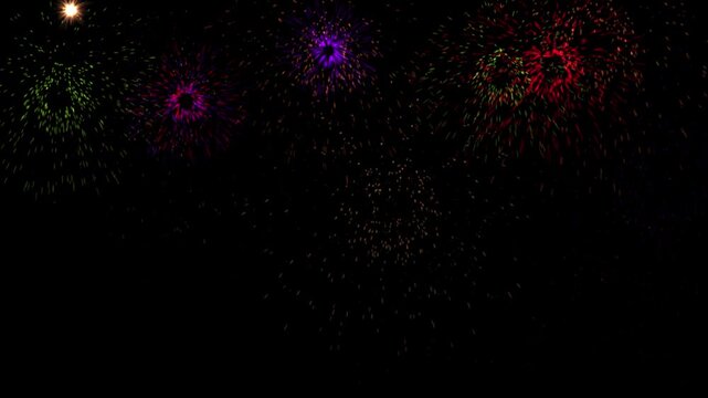 Colorful star-like shapes move dynamically against a dark background