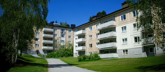 Sunny apartment complex, walkway, trees