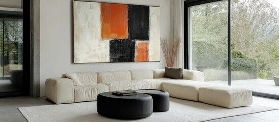 Modern living room with sectional sofa, abstract art, and patio view