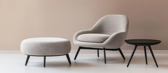 Beige armchair and ottoman with black table in a modern room