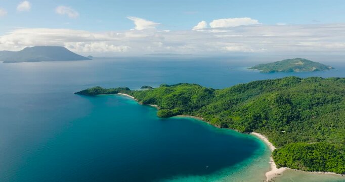 Tropical sandy beach in Islands surrounded by blue sea. Romblon, Philippines.