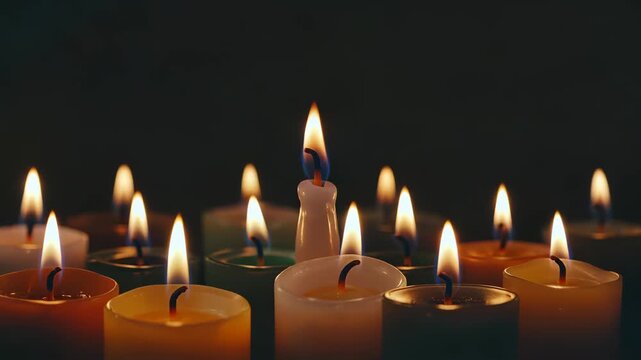 Multicolor candle burning close-up material