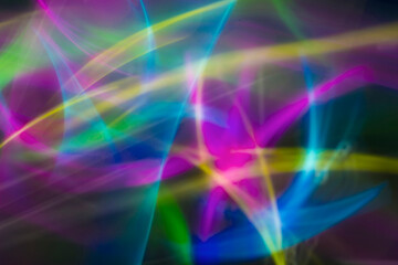 Obraz premium Abstract Orange Light Trails and Sparks on Dark Background