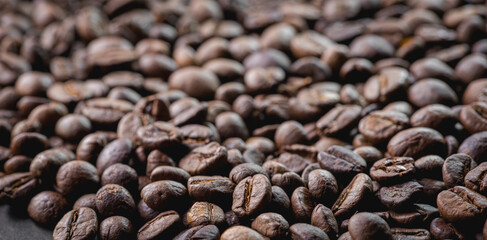 Close up of coffee beans are the background.