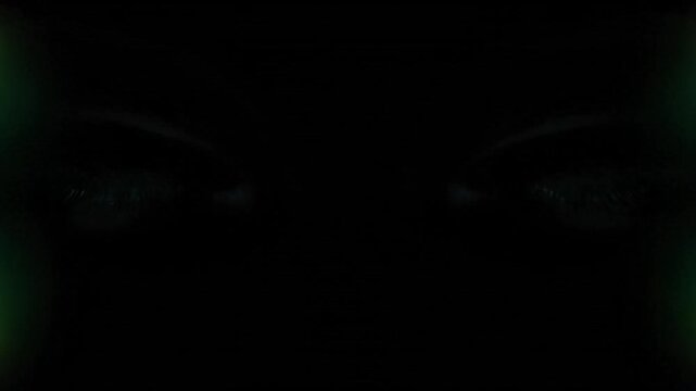 Intense Green Eyes with Electric Energy Bursts in Darkness