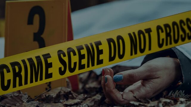 Crime scene do not cross police tape. Police Line Tape with dead body of murder victim lying on The Ground at crime scene.