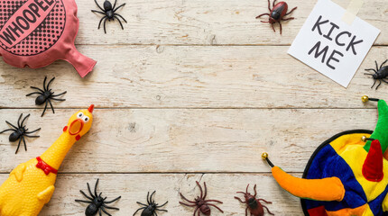 Whoopee cushion and rubber chicken for copy space with realistic style spiders bugs