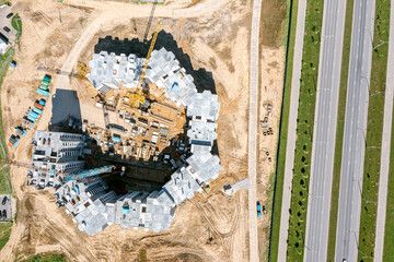 construction of a multistory residential building. aerial top view in summer sunny day.
