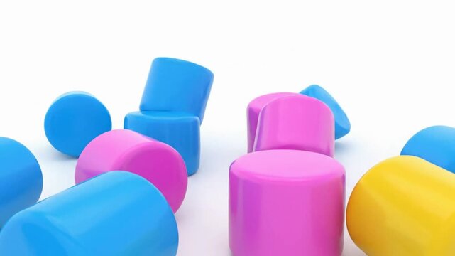 Colorful 3D objects scattered on a surface viewed from a low angle with vibrant cylinders and spheres