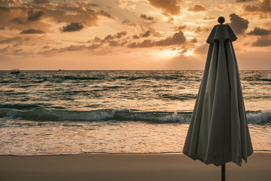 Empty Beach Umbrella at Phu Quoc Beach During a Stunning Golden Hour Sunset