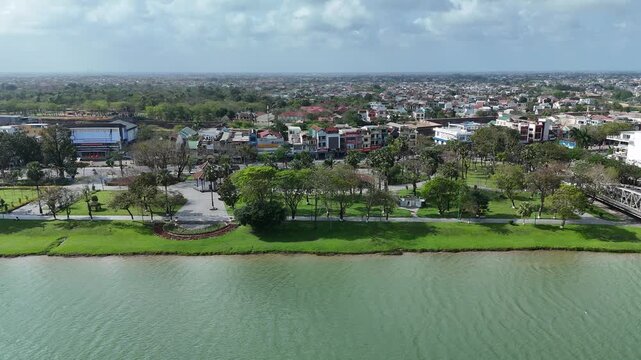 Hue City, Vietnam &ndash; 4K aerial drone footage of Perfume River, Truong Tien Bridge, historic skyline and urban waterfront