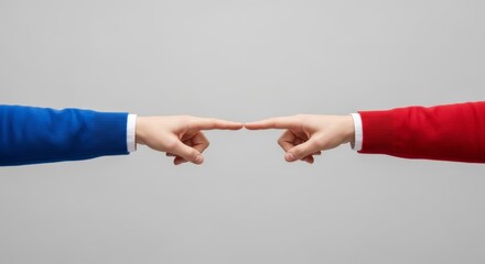 Two hands in red and blue sleeves reaching out to touch index fingers. Concept of connection, bipartisanship and agreement between political parties (Republican and Democrat) or opponents.