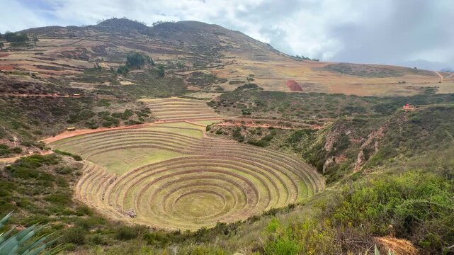 Sacred Valley Moray Zona arquelogica Moray Peru Per&uacute; circular terraces Salineras de Maras rainy season sunny cloudy Peruvian Andes Mount Patacancha Chic&oacute;n Ancopacha Ollantaytambo Cusco region pan left