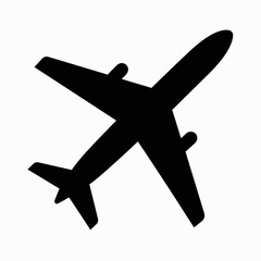 Obraz premium A simple black silhouette of a airplane in flight white