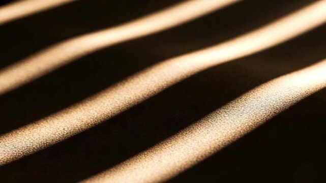 Closeup of gold metallic tubes or pipes on a dark background