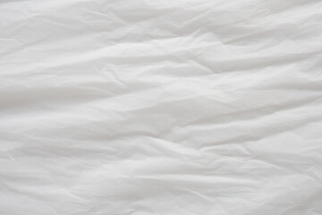 Obraz premium Crumpled White Plastic Sheet Surface Texture Background