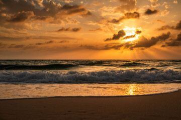Dynamic Ocean Waves and Golden Hour Sunset on a Tropical Beach
