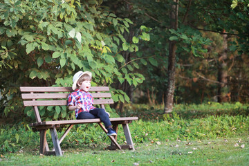 Leaf fall in the park. Children for a walk in the autumn park. Family. Fall. Happiness.