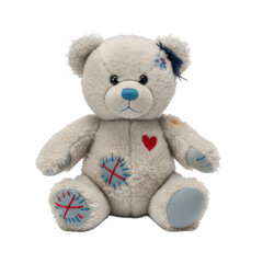 Obraz premium Worn teddy bear with patches and a heart