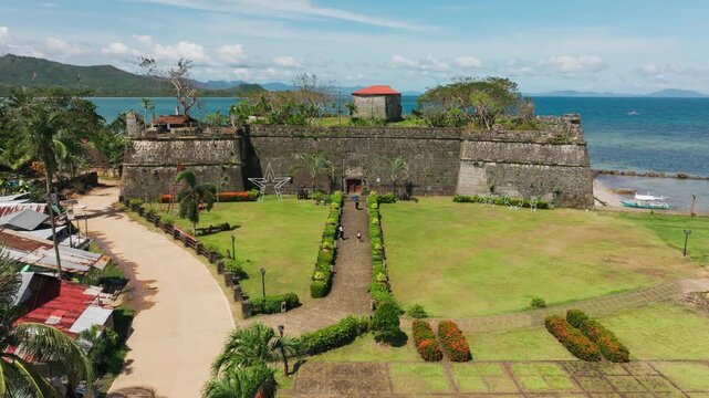 Aerial perspective highlights historic Taytay fortress set between town, sea