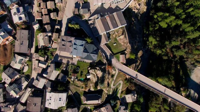 Bird's-eye view of a mountain bridge and rooftops in Saas-Fee, Valais, Switzerland