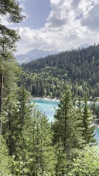 Lake Cauma Swiss Caumasee Switzerland alpine nature landscape aerial, vertical video