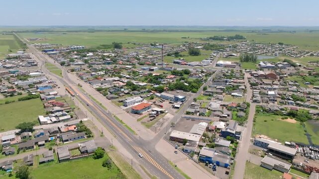 Wide aerial view of Capivari do Sul town and surrounding countryside in Brazil. Captured in D-Log with 10-bit color using a Hasselblad sensor.