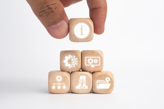 Wooden cubes with ITIL icons representing IT services, processes, and management, showcasing the concept of Information Technology Infrastructure Library.