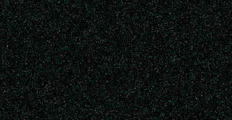 Shimmering dark emerald green glitter dust particles on black background texture. © Suraj Das